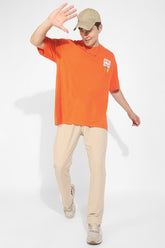 Under The Rains Orange Oversized Unisex T-Shirt By Purple Mango