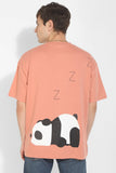 Snoozy Panda Peach Oversized Unisex T-Shirt By Purple Mango